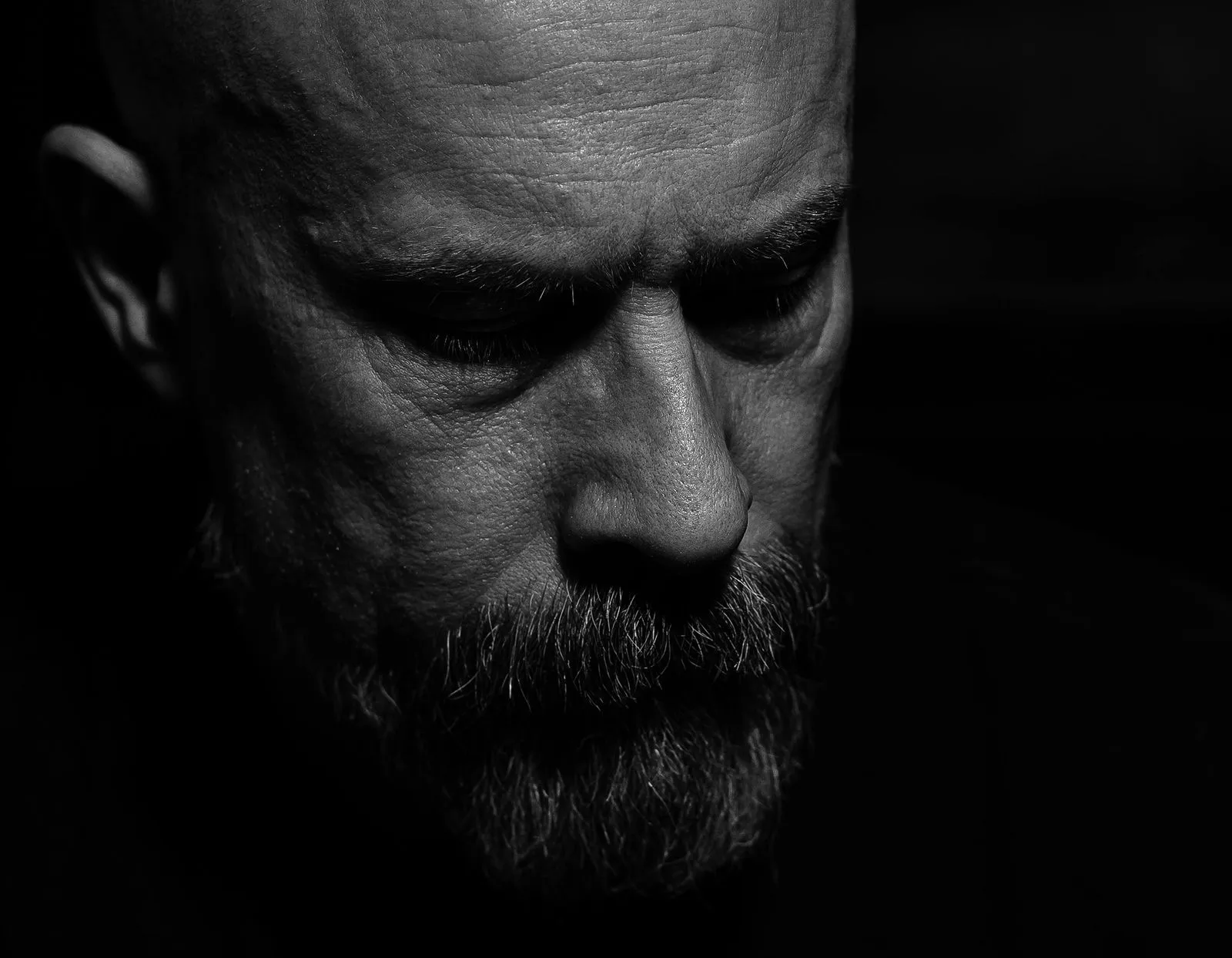 Pensive man in shadows